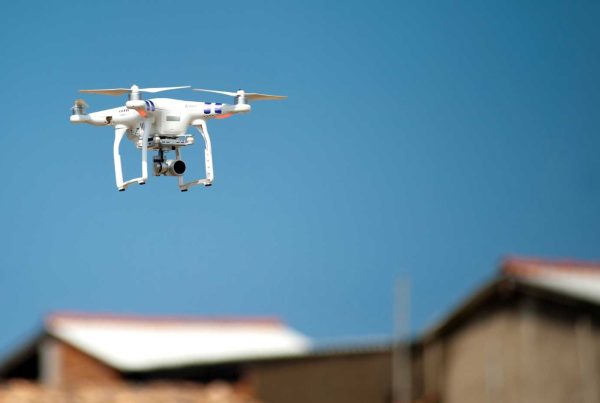 Eberl | Drone flying near a rooftop to perform an insurance roof inspection
